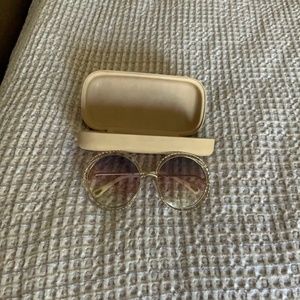 Gold rimmed sunglasses